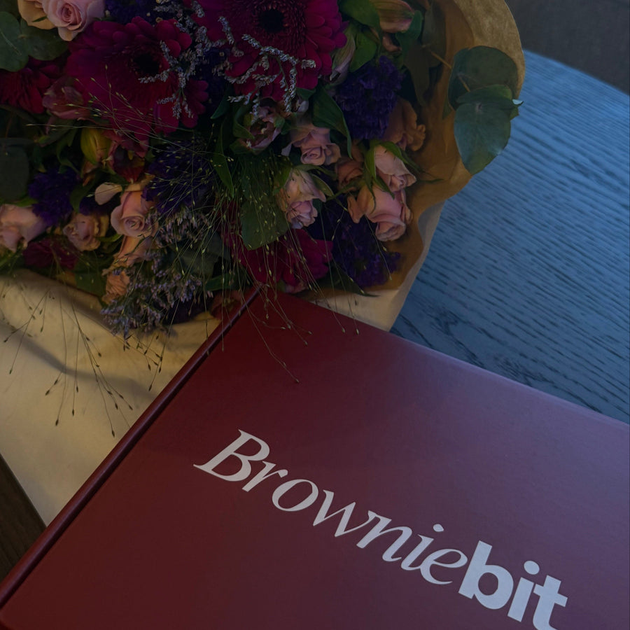 Flower with Browniebit brand box on top of a table